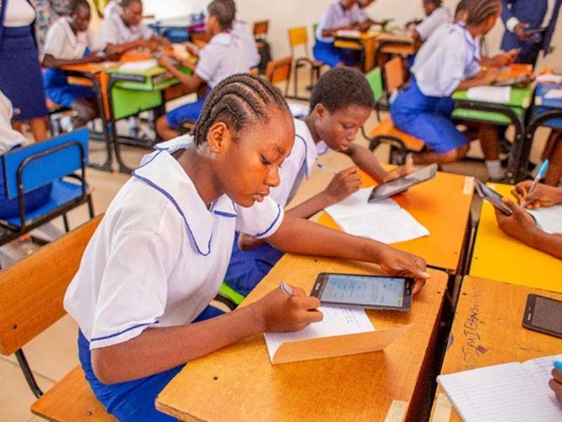 Secondary schools writing exams in a classroom