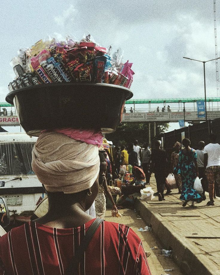 an aba woman with a bowl of mineral with her head
