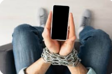 hands chained while holding a phone 