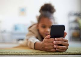 a girl holding a smartphone