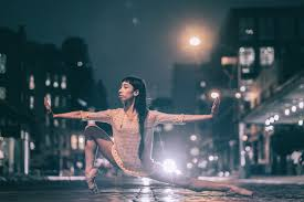 girl stretching on  the night streets 