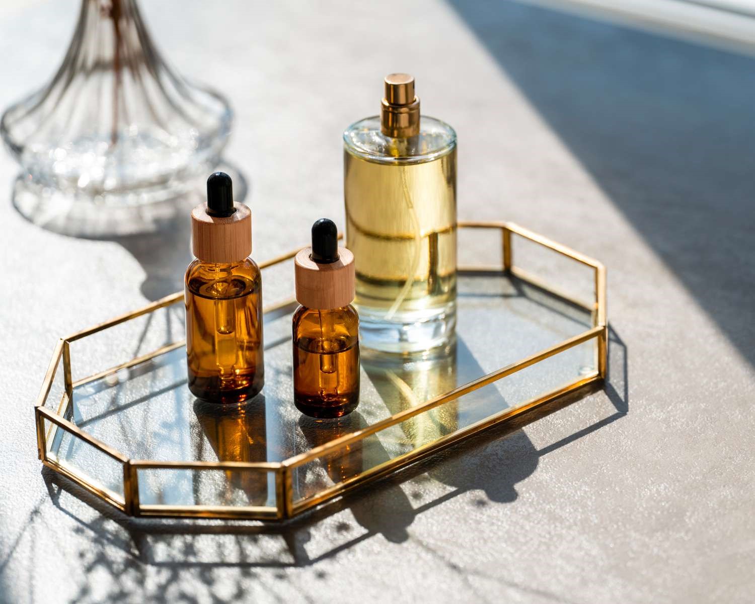 3 small sized  bottled scents arranged on the table