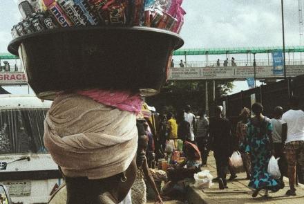 an aba woman with a bowl of mineral with her head