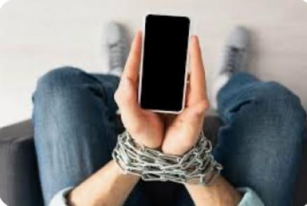 hands chained while holding a phone 