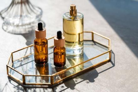 3 small sized  bottled scents arranged on the table