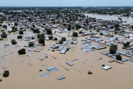 a town that is flooded up to the roof of the houses