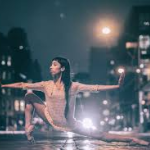 girl stretching on  the night streets 